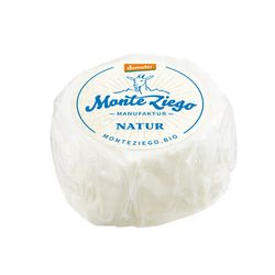 KI generiert: Auf dem Bild befindet sich eine durchsichtige Plastikverpackung mit Ziegenfrischkäse, der mit Kräutern und rosa Pfefferkörnern verfeinert ist. Das Etikett trägt die Aufschrift "ZiegenFRISCHKÄSE" der Marke Biovela.