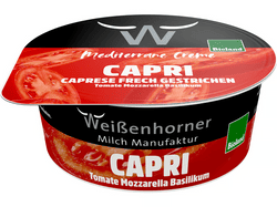 KI generiert: Auf dem Bild befindet sich eine durchsichtige Plastikverpackung mit Ziegenfrischkäse, der mit Kräutern und rosa Pfefferkörnern verfeinert ist. Das Etikett trägt die Aufschrift "ZiegenFRISCHKÄSE" der Marke Biovela.