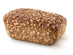 KI generiert: Das Bild zeigt ein rundes, rustikales Vollkornbrot mit einer knusprigen Kruste. Der Hauptinhalt ist das Brot, das auf einem hellen Hintergrund präsentiert wird.