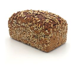KI generiert: Das Bild zeigt ein rundes, rustikales Vollkornbrot mit einer knusprigen Kruste. Der Hauptinhalt ist das Brot, das auf einem hellen Hintergrund präsentiert wird.